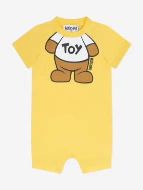 Moschino Baby Teddy Toy Romper in Yellow